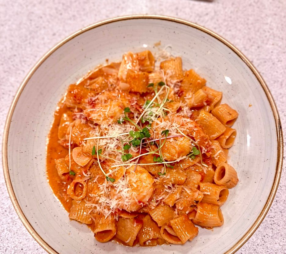 A shared pasta dish served at Full Spread Party at Aglio